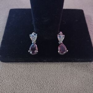 Silver tone dangle earrings with purple stone and post backings